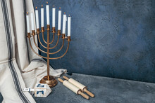 Jewish Hanukkah Menorah 9 Branch Candlestick, Dreidel, Sefer Torah. Holiday Candle Holder, Torah Scroll, Dreidl. Traditional Hebrew Festival Of Lights Candelabra. Background With Copy Space