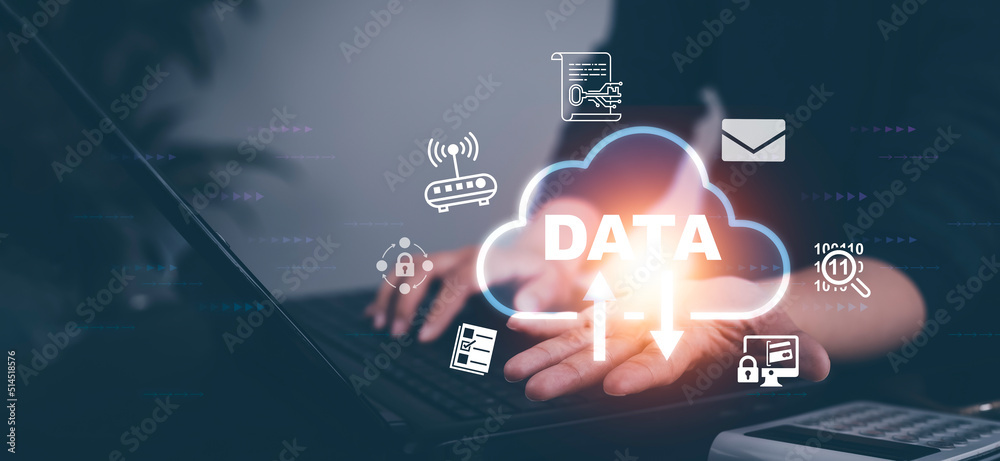 Hand using a laptop with Analytics and Data Management System on the ...