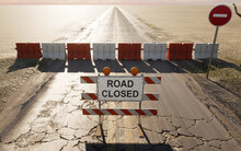 Road Closed Sign In A Desert Road, 3D Illustration.