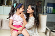 © GAJENDRRA BHATI  - Happy indian grandmother with her granddaughter sitting together at home, love and care, Asian senior people with girl child.