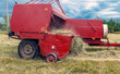   Hay collection. Pressing and pressing hay bales with a baler