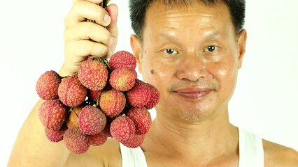 Wall Mural - Thai farmer with lychee  fruit, indoor Chiangmai Thailand.