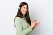 © luismolinero - Young Brazilian woman isolated on white background applauding