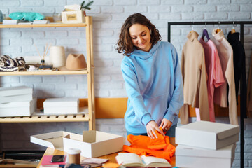 Wall Mural - Close-up of preparing a parcel on the table. Online small business entrepreneur merchants working at store preparing products to deliver to customers. Dropshipping delivery concept.