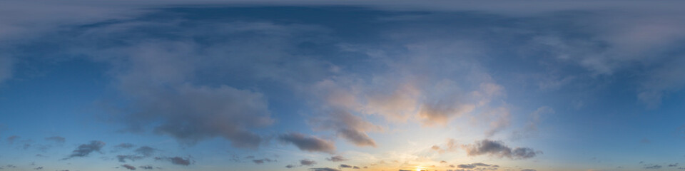 Wall Mural - panorama of a dark blue sunset sky with golden cumulus clouds. seamless hdr 360 panorama in spherica