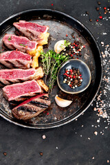 Wall Mural - Grilled beef steak with pepper and salt.