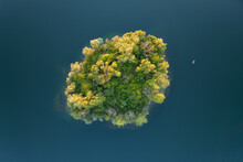 Aerial View On A Little Island And A Small Boat In The Quarry Lake Binsfeldsee At Speyer In Germany.