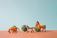 Creative Concept Made With Toy Horses And Cactus Against Pastel Blue, Brown Background. Minimal Western Concept.