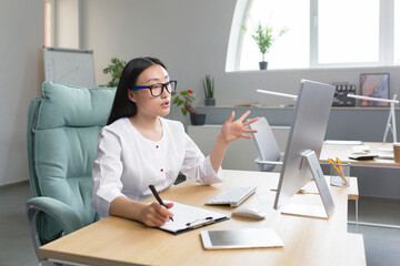 young beautiful asian female doctor consults patients remotely online consultation, woman works in o