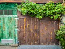 Weathered Green And Brown Wooden Doors.