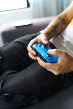 Remote Blue Video Game Control Details, Relaxed Lifestyle With Modern Hobbies, Holding With Their Hands, Technology And Leisure