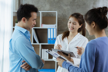 Wall Mural - Groups Asian people chatting, business men and women meeting in a conference room, young business man running and running startups, young and energetic group running companies. Startup company concept