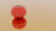 Pomodoro technique symbol on orange background with copy space. Time management concept. Red plastic kitchen mechanic clock. Tomato timer. 3d render