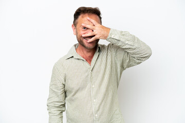 Middle age caucasian man isolated on white background covering eyes by hands and smiling