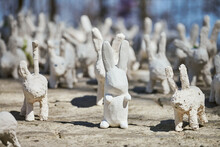 White Rabbit Statues Made Of Plaster At Outdoor Art Exhibition, Funny White Hares On Street