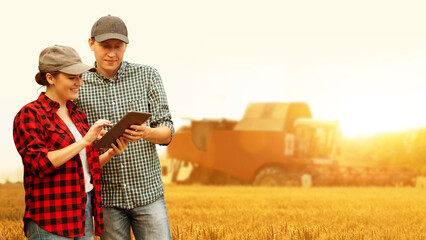 Sticker - Two farmers with digital tablet on a background of combine harvester. Smart farming concept.