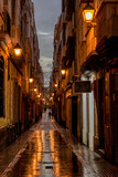 Fototapeta Uliczki - Night view of a typical street in the downtown of Cadiz, Andalusia, Spain.
