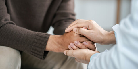 Wall Mural - Male doctors shake hands with patients encouraging each other and praying for blessings. To offer love, concern, and encouragement while checking the patient's health. concept of medicine