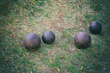 cannon balls round shells, traditional cannon cartridges on the background of the earth