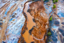 Dried Rusty River Bed Over Wasteland Grey Background, Contamination Texture, Drone View Directly Above