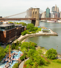 Aerial View Of Brooklyn Bridge Park With The Bridge And Manhattan In The Distance