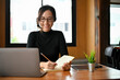 Professional young Asian female office worker having an online meeting