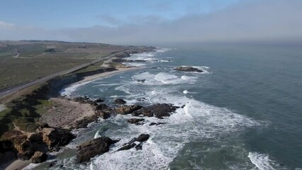 Poster - Beautiful aerial view of Big Sur on the California coastline. Sunny morning with marine layers above the Pacific Ocean.