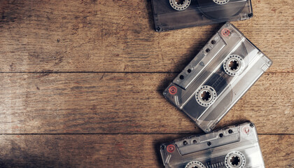 Poster - Beautiful Audio cassette tape on a brown old wooden table. Minimalism retro style concept. 80s. Background pattern for design.