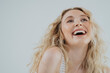 © Westend61 - Happy young woman with blond hair against white background