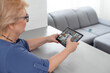 © Angelov - telemedicine concept, old woman with tablet pc during an online consultation with her doctor in her living room.