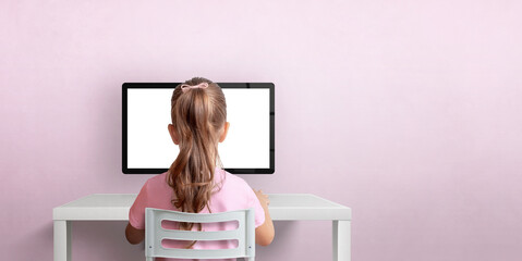 Poster - Girl sitting on a chair and working on the computer. Isolated computer display for design promotion. Pink wall with copy space