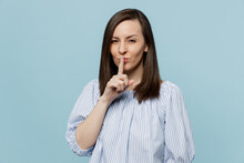 Young Happy Secret Fun Woman She 20s Wears Casual Blouse Say Hush Be Quiet With Finger On Lips Shhh Gesture Isolated On Pastel Plain Light Blue Background Studio Portrait. People Lifestyle Concept