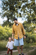 © Anastasia - A father spends time with his son. Happy parenthood. A father and his son are walking in the field. The father is his toddler son.