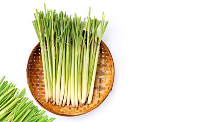 Sticker - Fresh lemongrass in wooden bamboo threshing basket on white background.