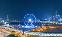 Ferris Wheel In Hong Kong City At Night