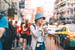 © dodotone - Young adult asian foodie woman backpack traveller eating asia dessert with boba at china town street food
