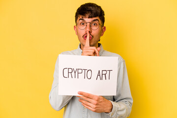 Wall Mural - Young hispanic man holding crypto art placard isolated on yellow background keeping a secret or asking for silence.