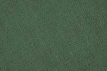 Dark Green Woven Surface Close-up. Linen Textile Texture. Glamorous Color Fabric Background. Textured Braided Gray-green Backdrop Or Wallpaper. Macro