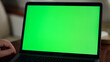 © stockbusters - Closeup chroma key laptop screen in airplane cabin. Man watching mockup webinar