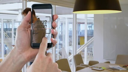 Poster - Animation of hands of caucasian man with smartphone with qr code over businessman in office