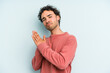 © Asier - Young caucasian man isolated on blue background feeling energetic and comfortable, rubbing hands confident.