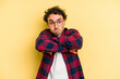 © Asier - Young caucasian man isolated on yellow background shrugs shoulders and open eyes confused.