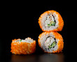 Sushi California Roll on black background