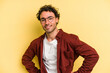 © Asier - Young caucasian man isolated on yellow background happy, smiling and cheerful.
