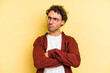 © Asier - Young caucasian man isolated on yellow background tired of a repetitive task.