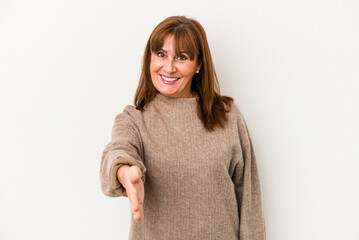 Sticker - Middle age caucasian woman isolated on white background stretching hand at camera in greeting gesture.