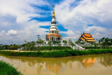 Background of a beautiful church in the middle of the water, important religious attractions in Udon Thani province of Thailand, Wat Pa Ban Tat,Atthaborin Luang Maha Bua Yannasampanno Museum Building.