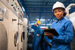 © anon - African American Young woman worker  in protective uniform operating machine at factory Industrial.People working in industry.Portrait of Female  Engineer at work place.