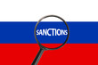 Sanctions against aggressor Russia with magnifier glass, economic and political sanctions against Russia, sanctions on Russian flag