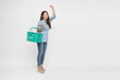 © comzeal - Young Asian woman smiling and holding shopping basket isolated on white background, Full body composition